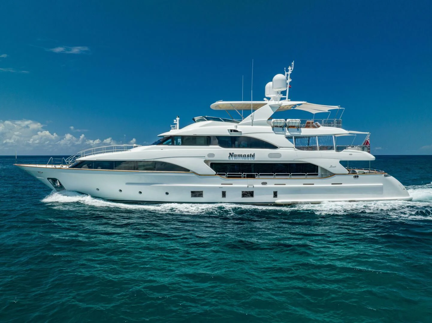 a white yacht in the ocean aboard NAMASTE Yacht for Sale