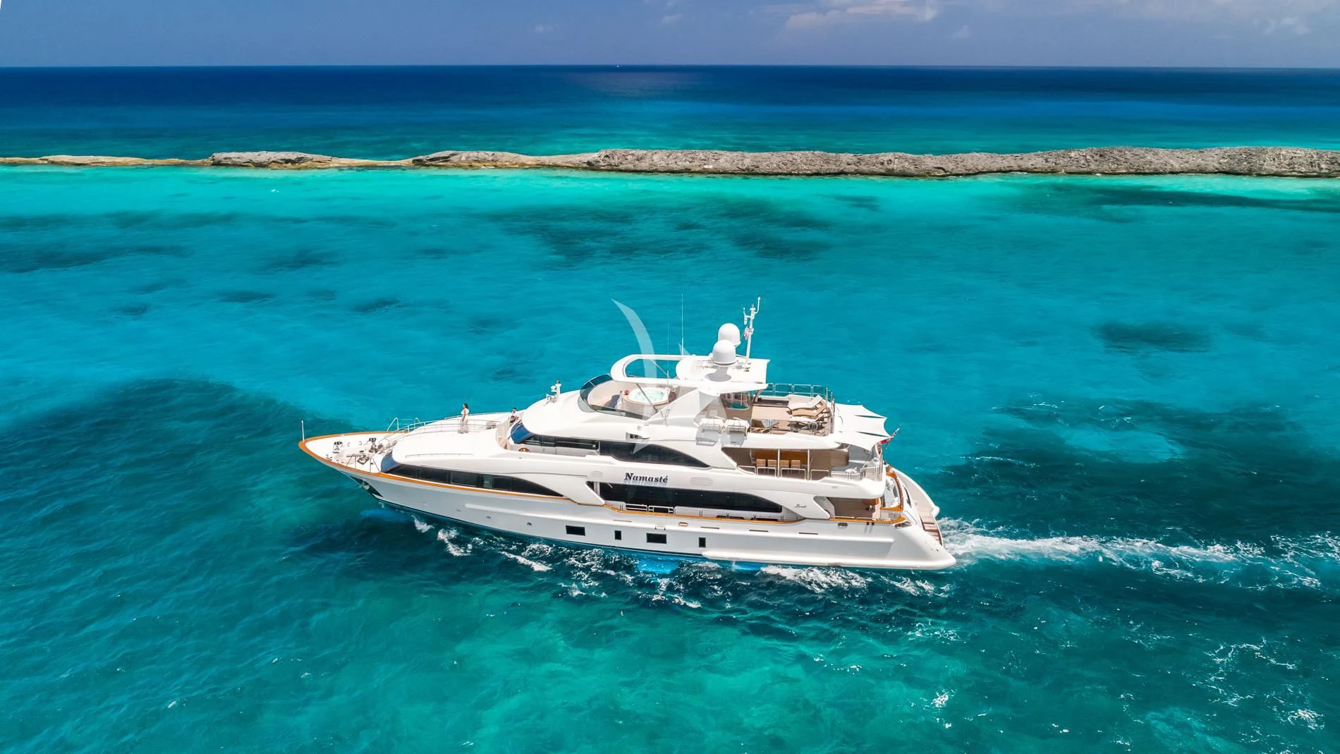 a white boat in the water aboard NAMASTE Yacht for Sale
