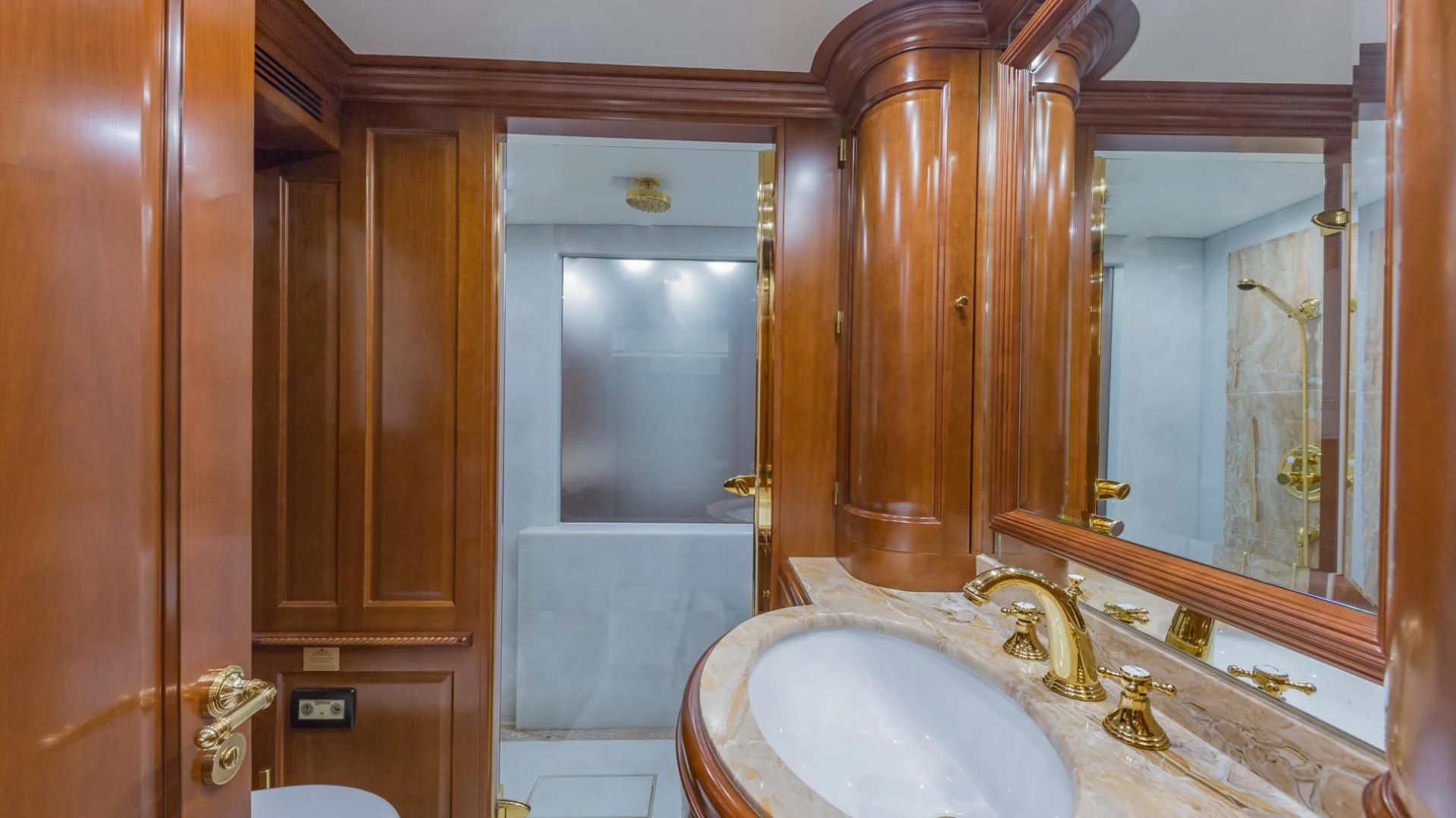a bathroom with a large mirror aboard NAMASTE Yacht for Sale