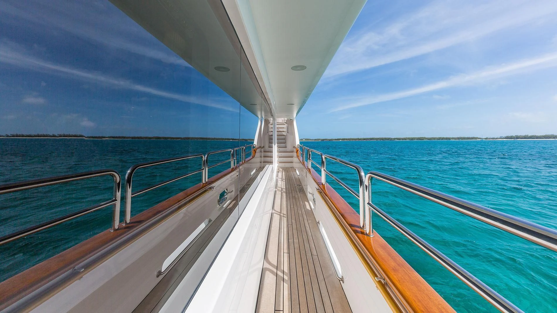 a long wooden walkway over water aboard NAMASTE Yacht for Sale