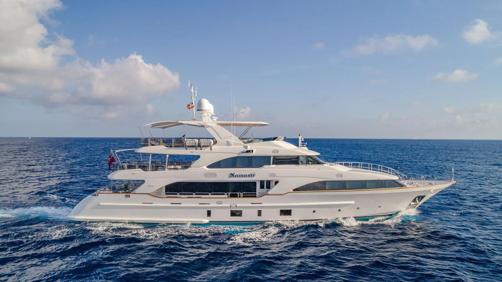 a white yacht in the ocean aboard NAMASTE Yacht for Sale