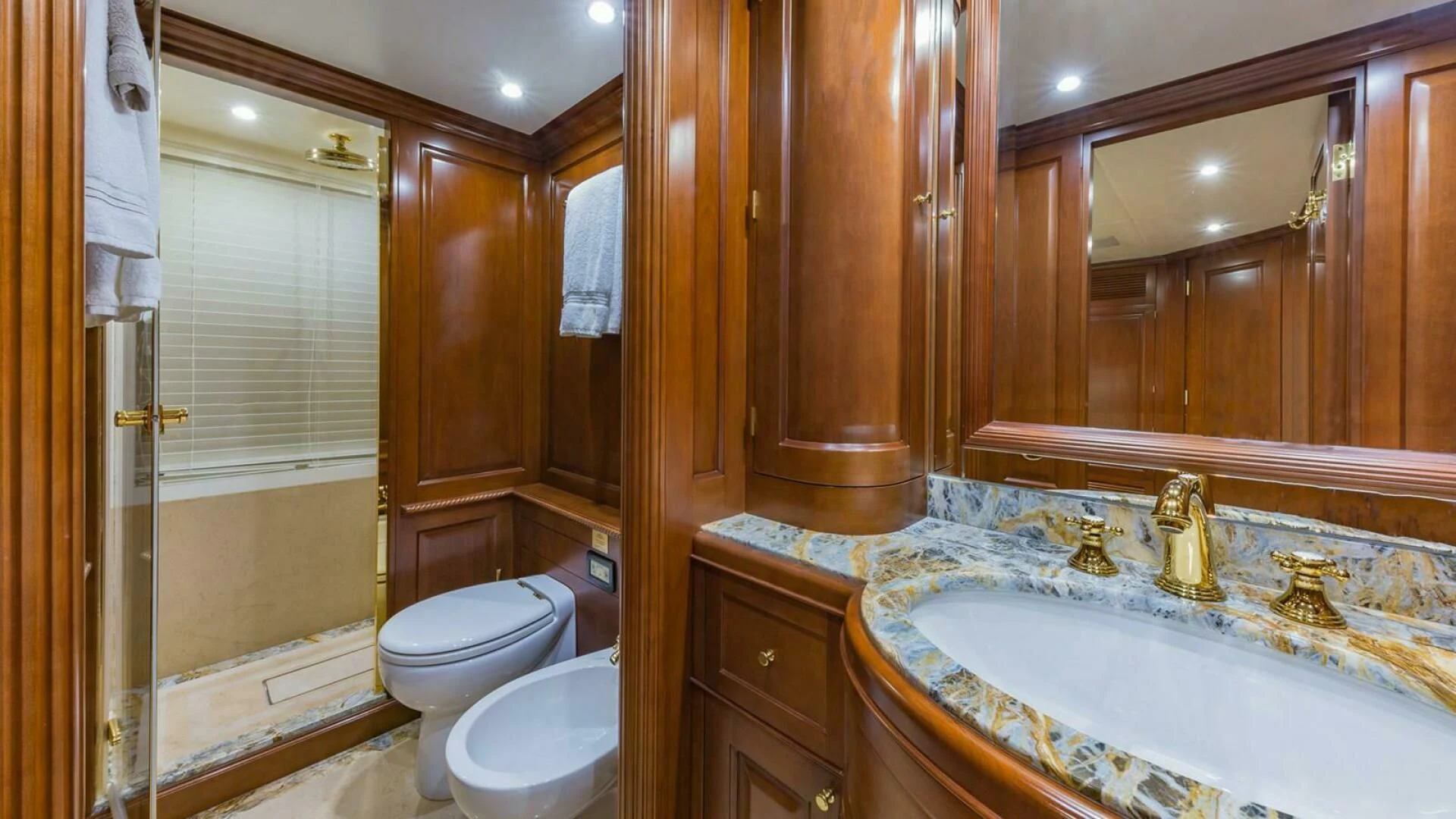 a bathroom with a large bathtub and toilet aboard NAMASTE Yacht for Sale