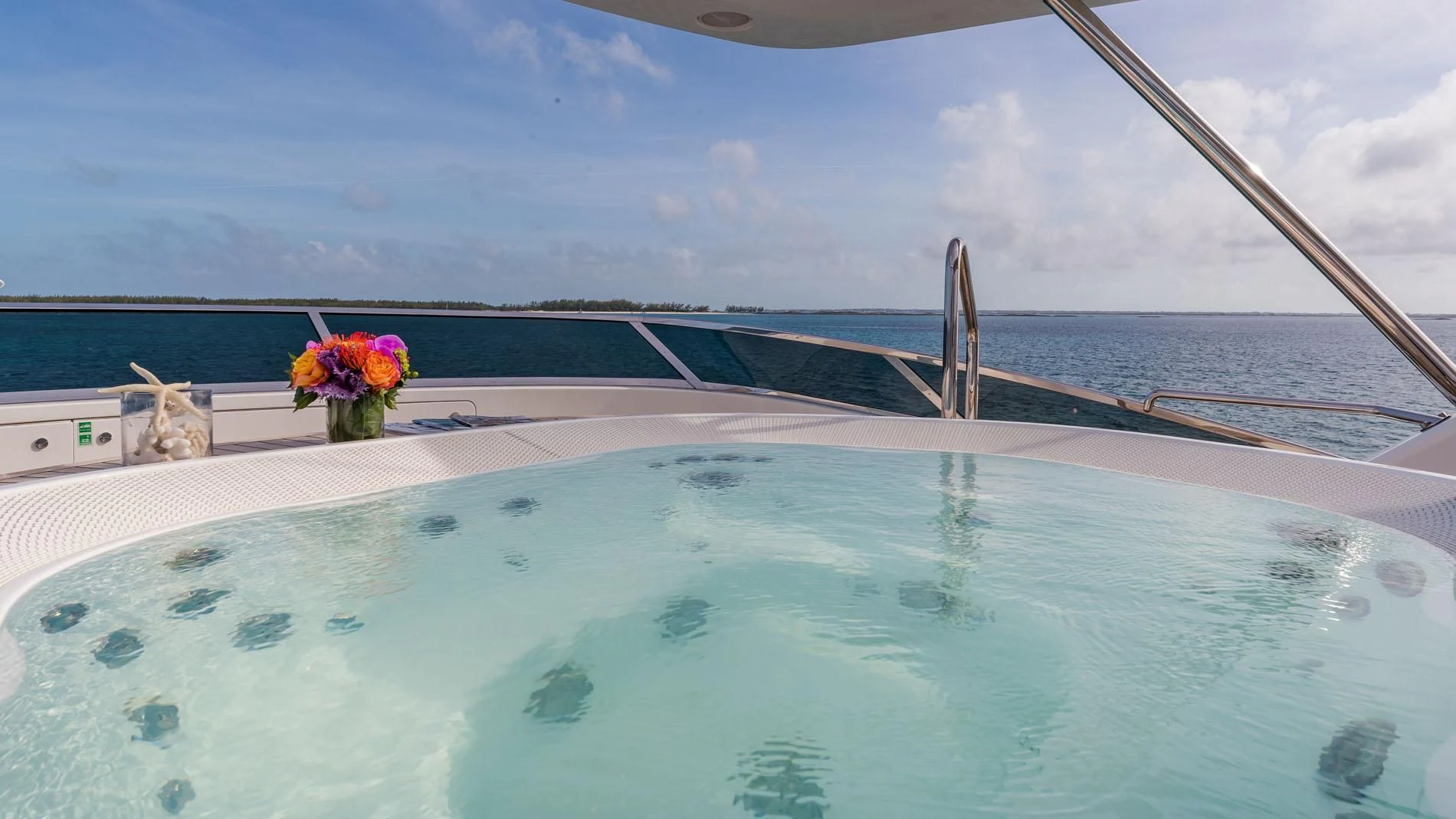 a pool with flowers aboard NAMASTE Yacht for Sale
