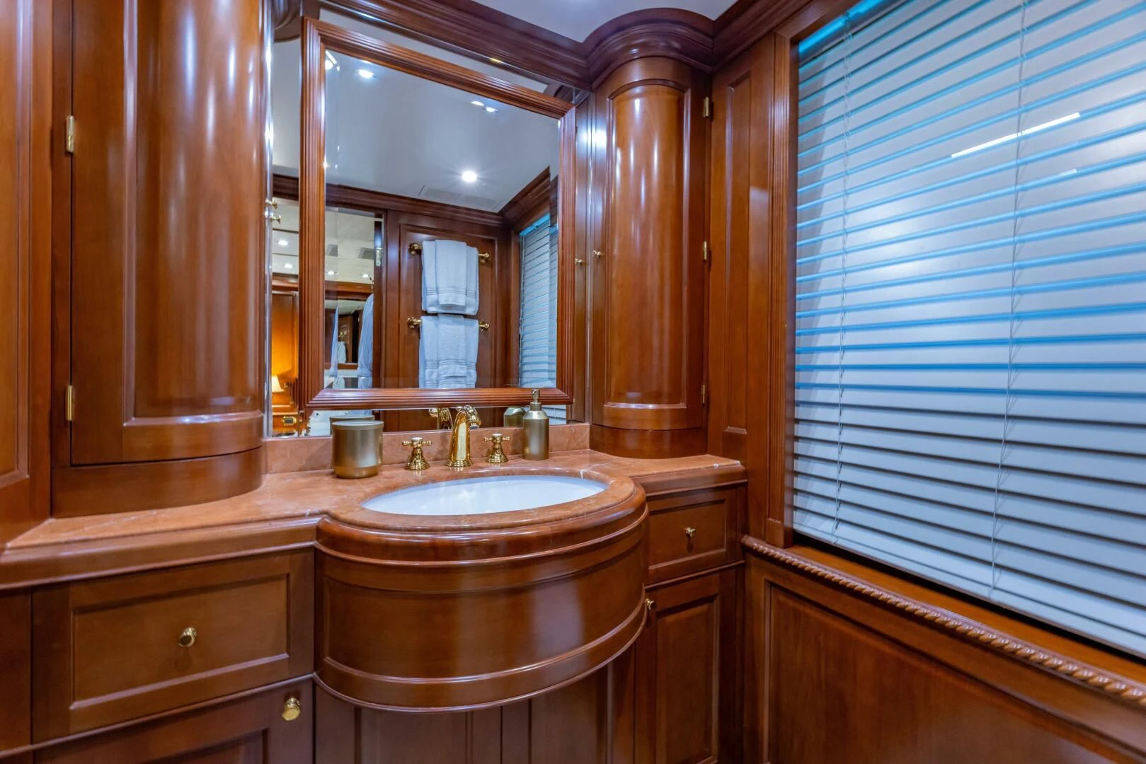 a bathroom with a sink and a mirror aboard NAMASTE Yacht for Sale