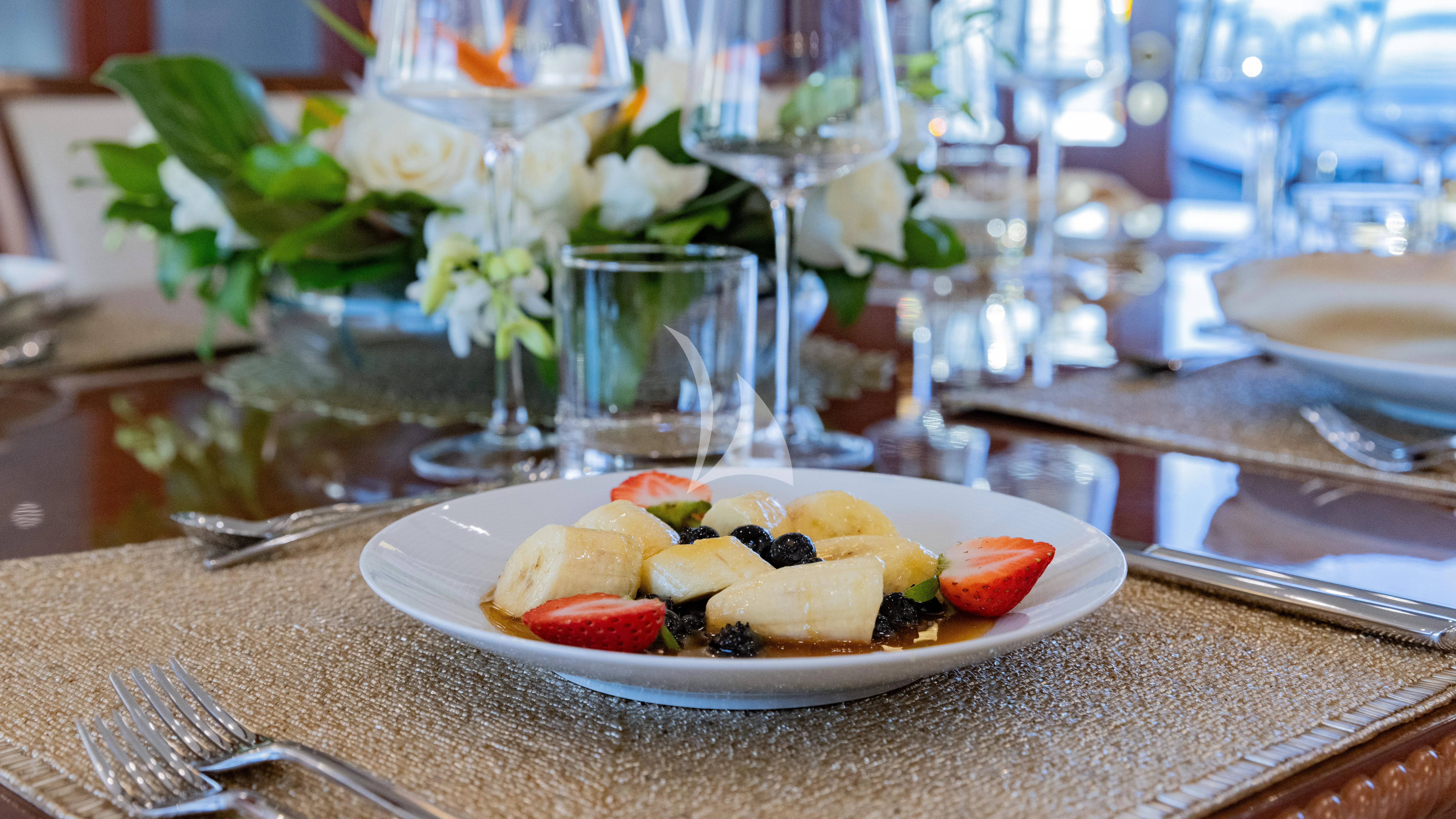 a plate of food aboard NAMASTE Yacht for Sale