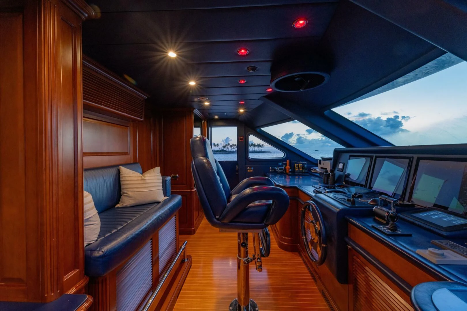 inside of a vehicle with a desk and chairs and a computer aboard NAMASTE Yacht for Sale