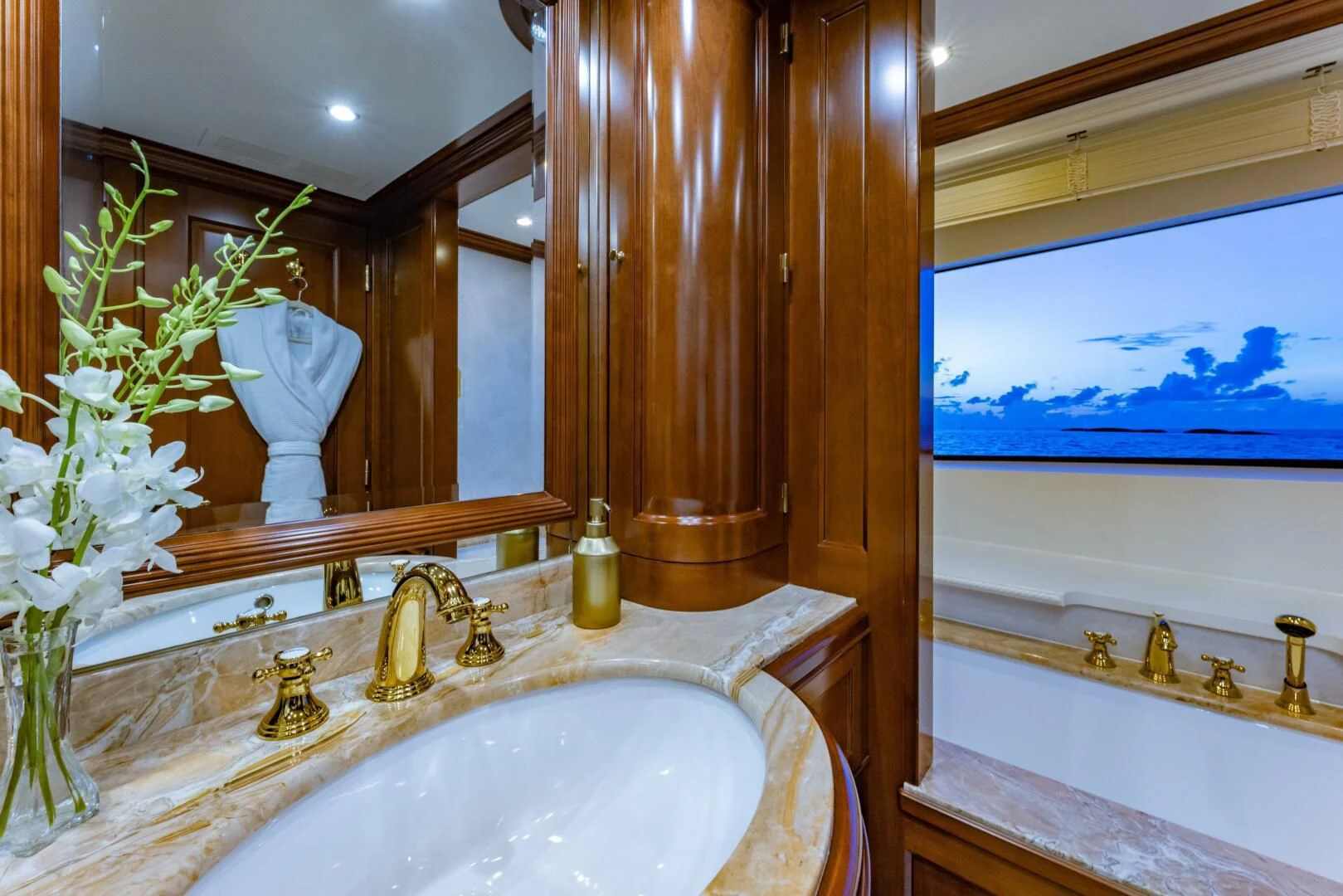 a bathroom with a large mirror aboard NAMASTE Yacht for Sale