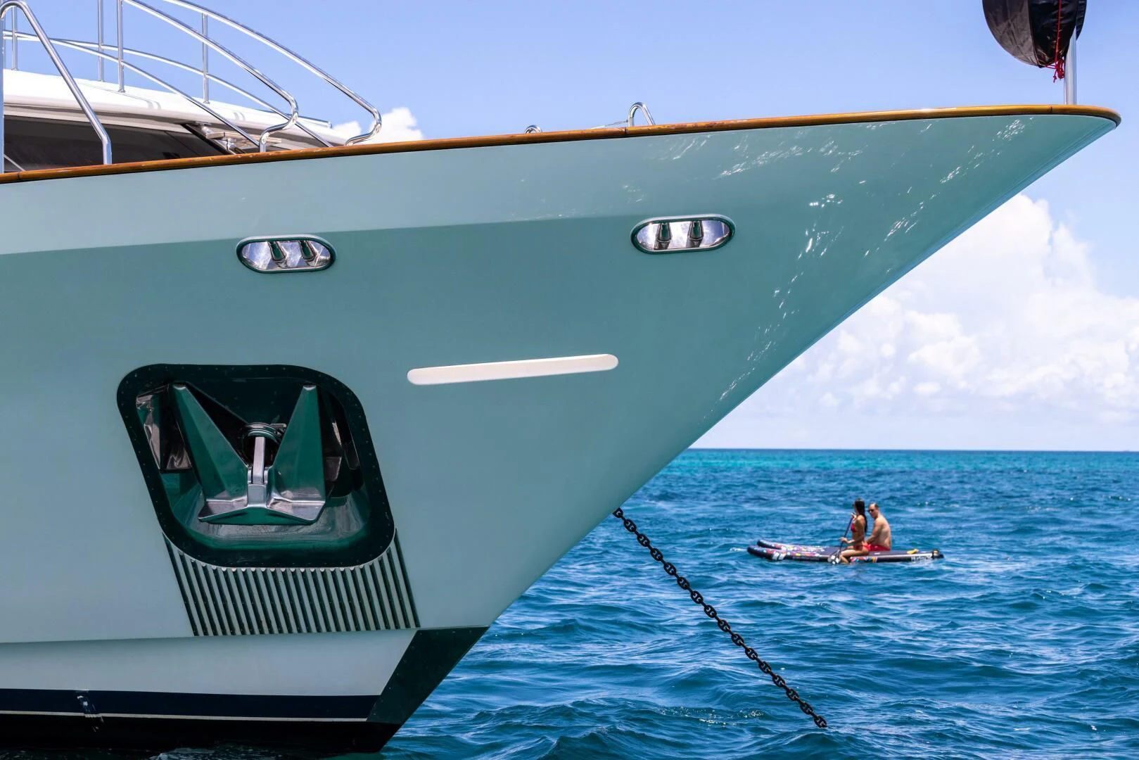 a man and a woman in a boat on the water aboard NAMASTE Yacht for Sale
