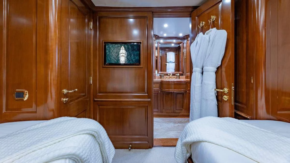 a room with a bed and a closet aboard NAMASTE Yacht for Sale