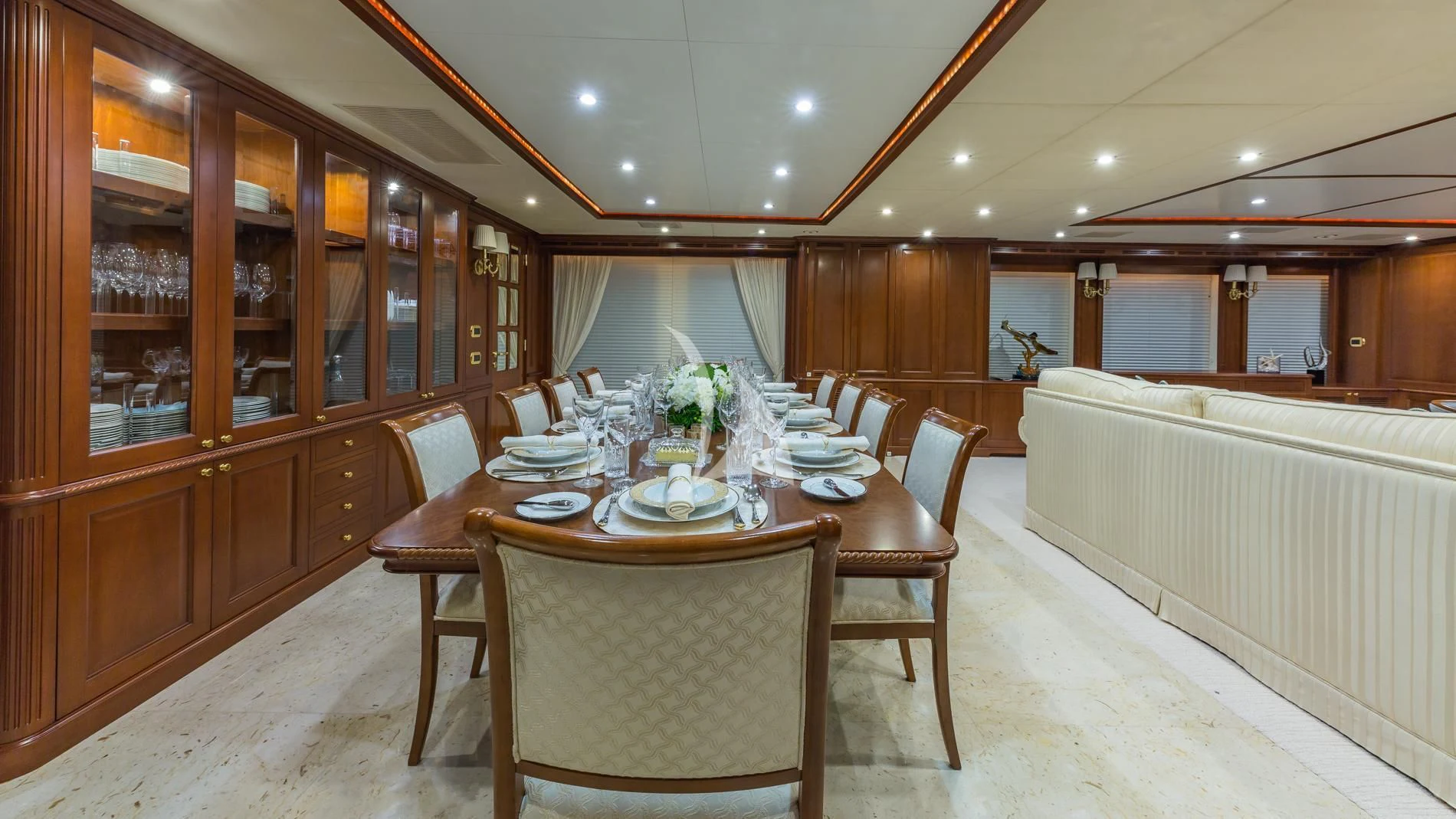 a dining table in a room aboard NAMASTE Yacht for Sale