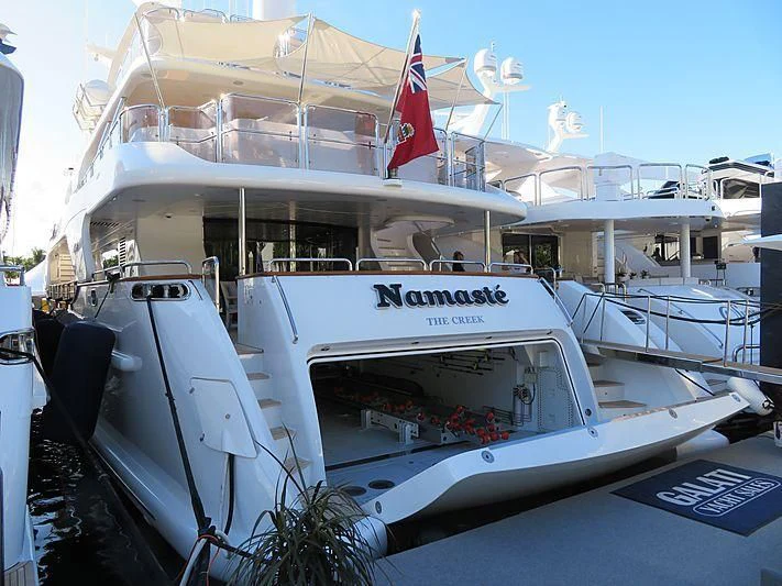 a boat with a flag on the front aboard NAMASTE Yacht for Sale