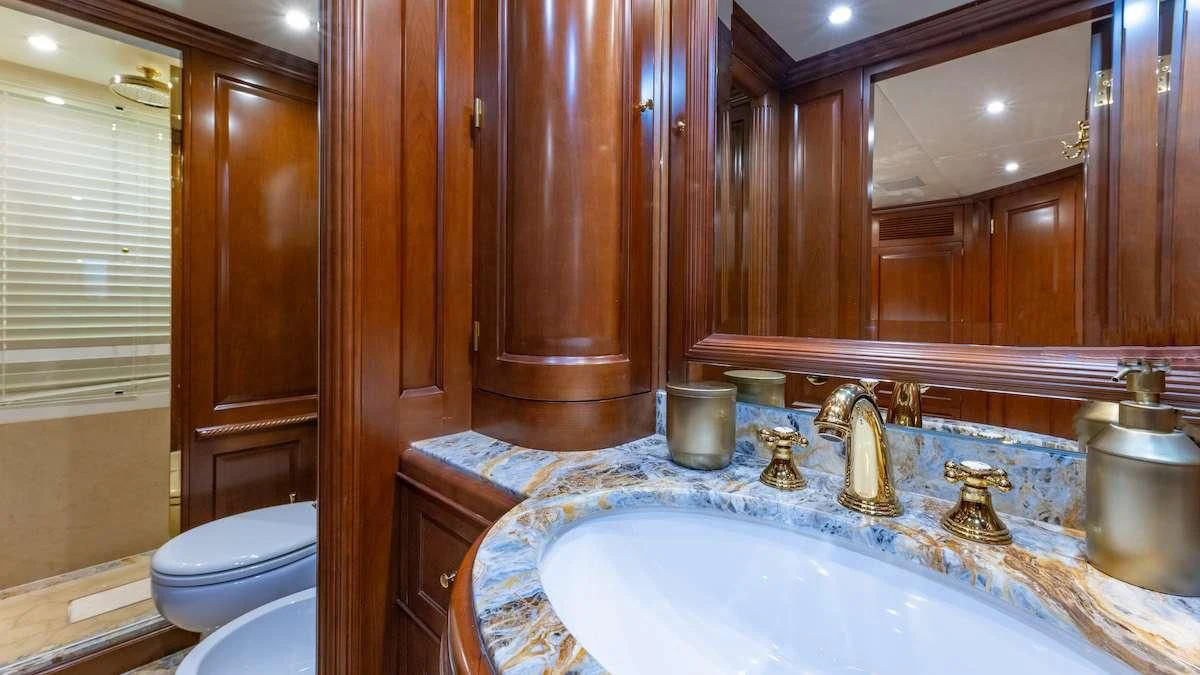 a bathroom with a sink and toilet aboard NAMASTE Yacht for Sale