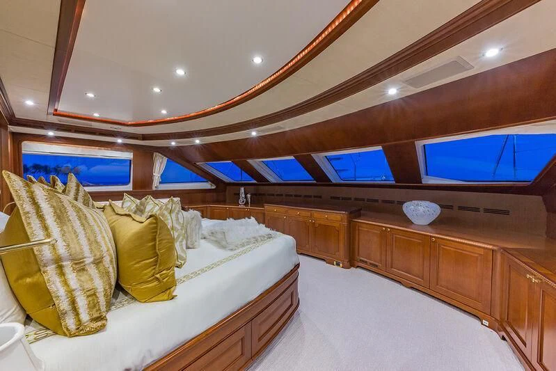 a room with a bed and a tv aboard NAMASTE Yacht for Sale