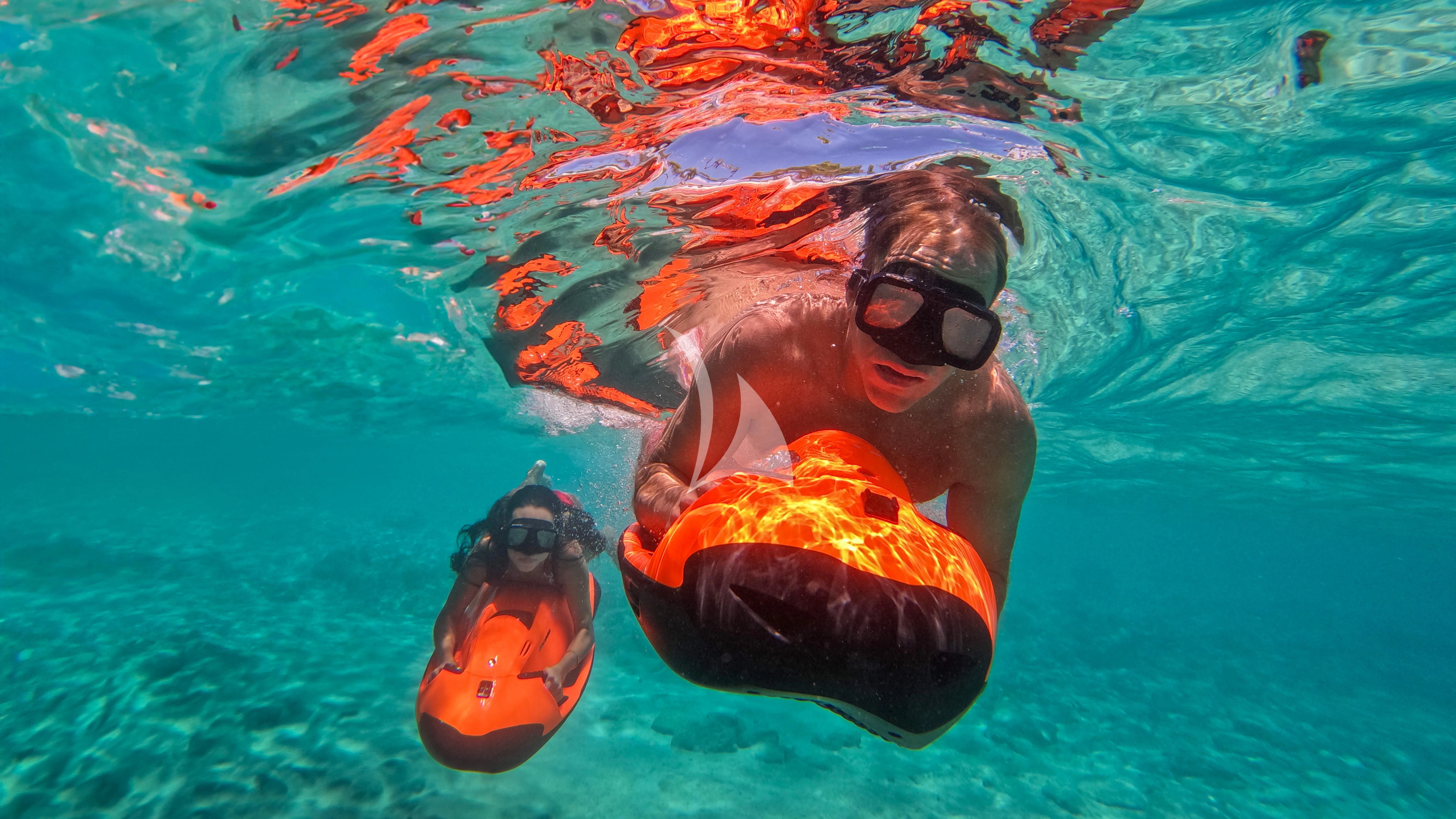 a man and a woman in the water aboard NAMASTE Yacht for Sale