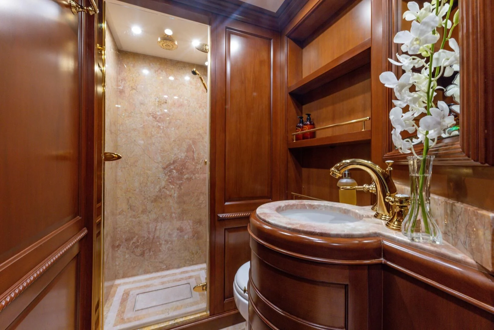 a bathroom with a sink and toilet aboard NAMASTE Yacht for Sale
