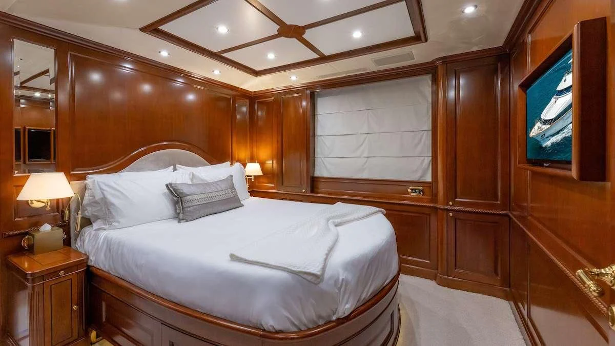 a bed in a room aboard NAMASTE Yacht for Sale