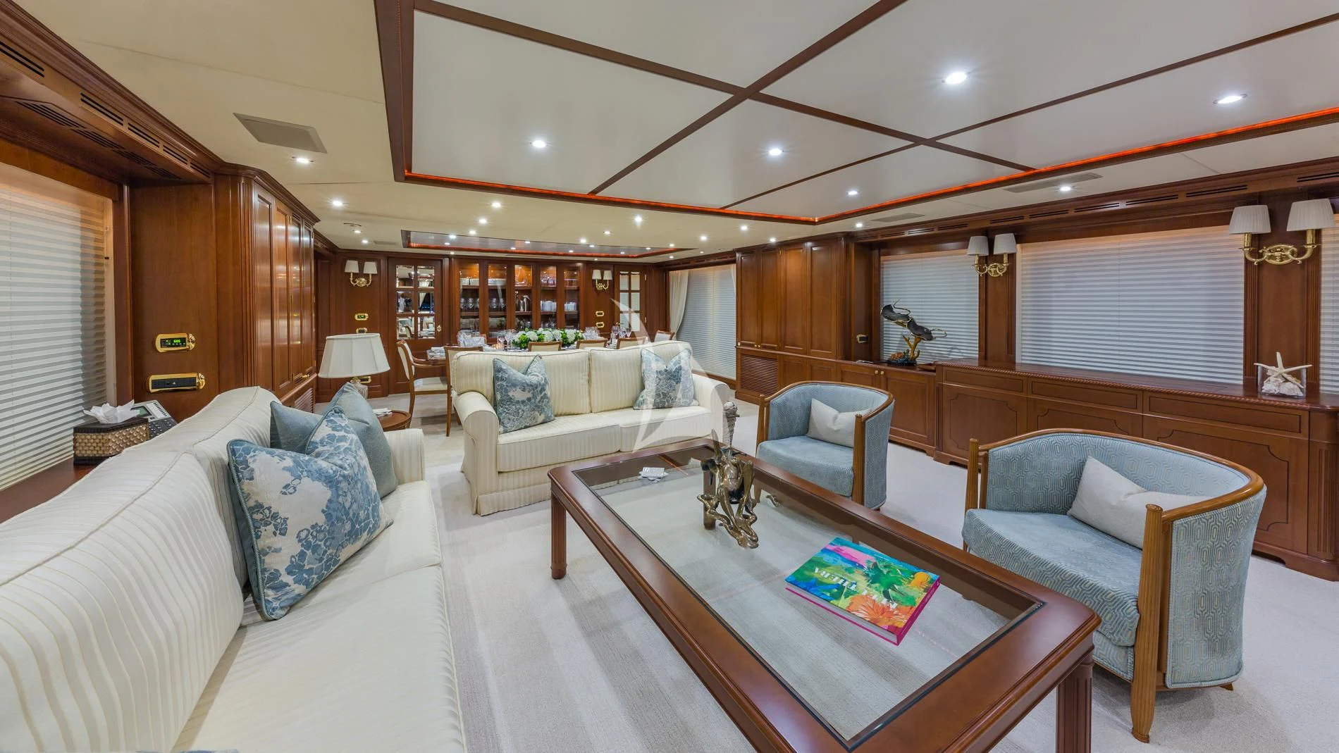 a living room with a couch and a table aboard NAMASTE Yacht for Sale