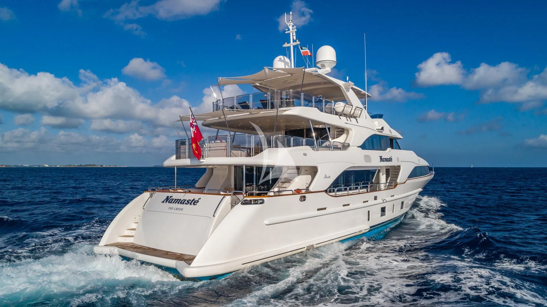 a white boat in the water aboard NAMASTE Yacht for Sale