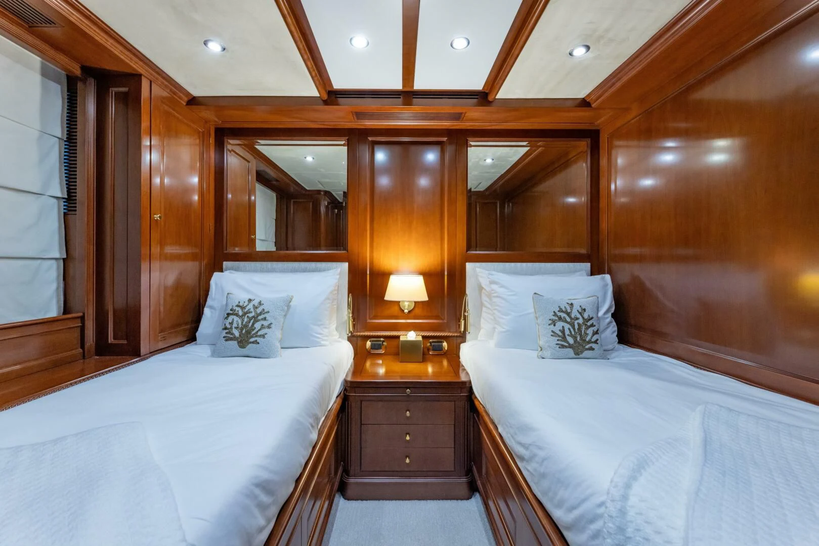 a couple of beds in a hotel room aboard NAMASTE Yacht for Sale