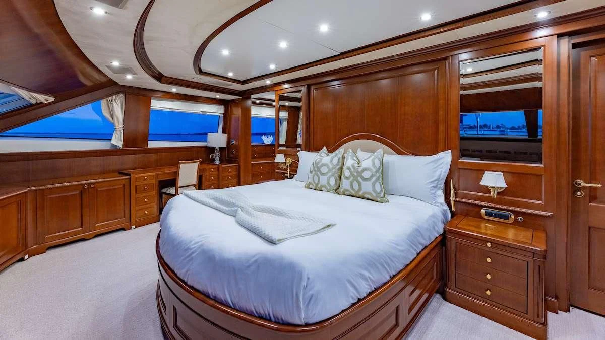 a bed in a room aboard NAMASTE Yacht for Sale
