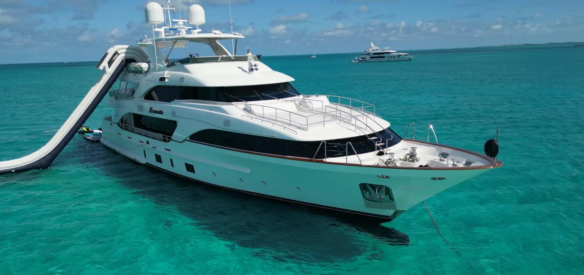 a white yacht in the ocean aboard NAMASTE Yacht for Sale