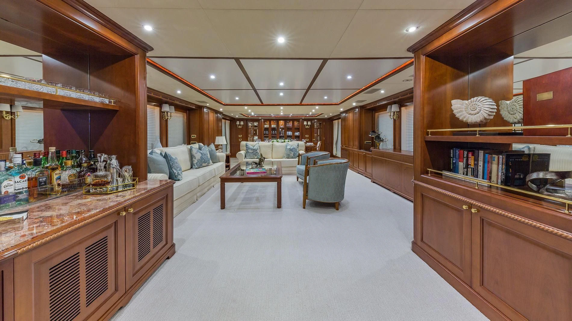 a room with a couch and a table and a bed aboard NAMASTE Yacht for Sale