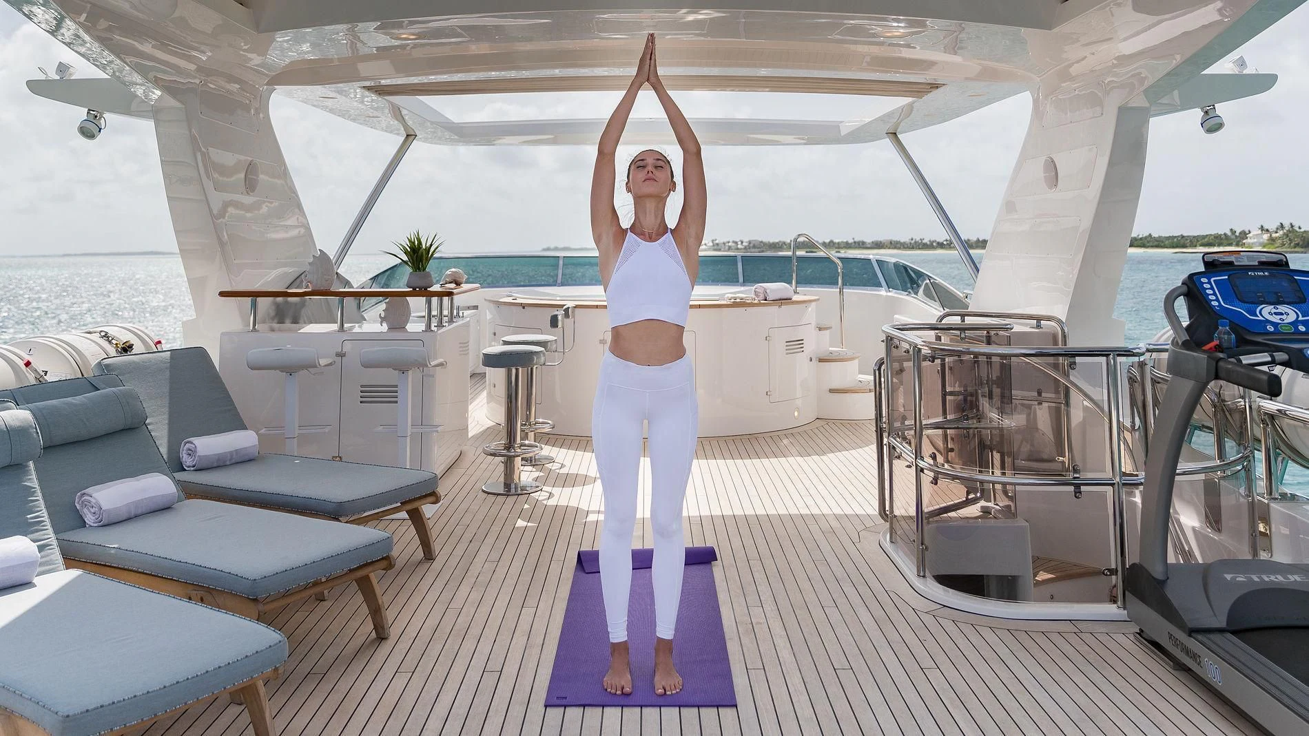 a person standing on a deck aboard NAMASTE Yacht for Sale
