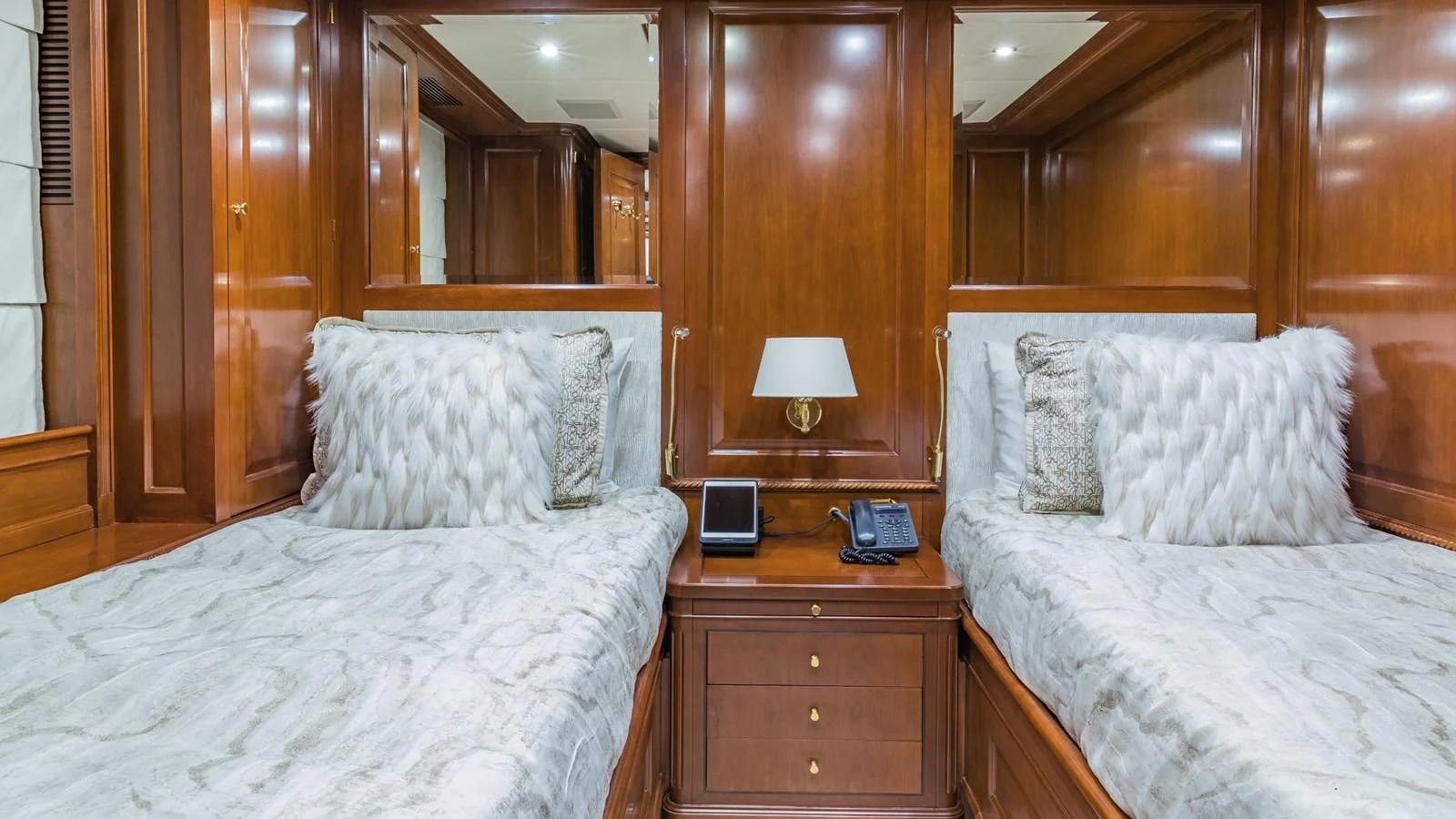 a couple of beds in a hotel room aboard NAMASTE Yacht for Sale