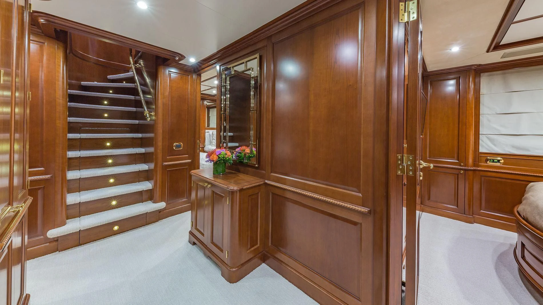 a room with wooden cabinets aboard NAMASTE Yacht for Sale