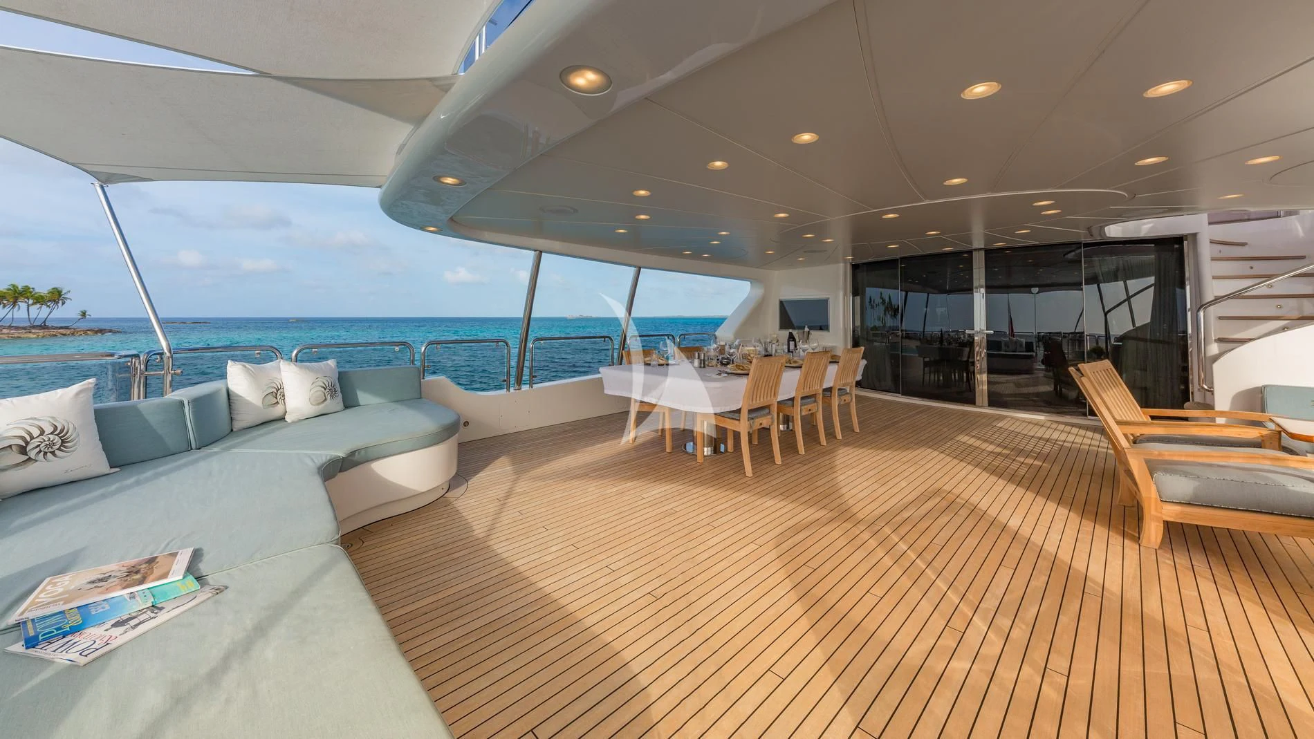 a room with a couch and a pool aboard NAMASTE Yacht for Sale