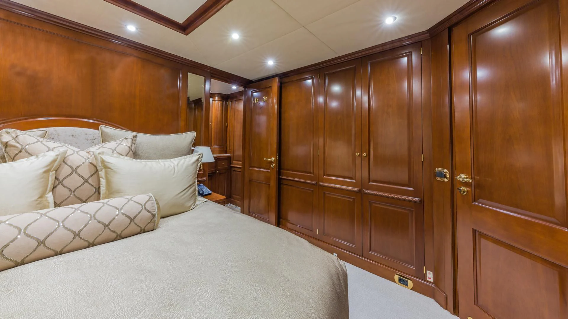 a bed with white sheets aboard NAMASTE Yacht for Sale