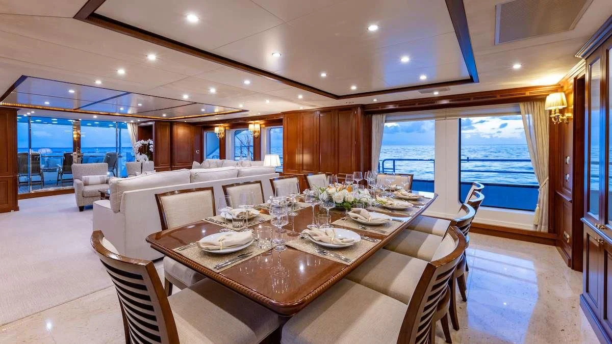 a dining room with a large table aboard NAMASTE Yacht for Sale