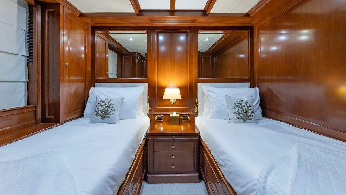 a couple of beds in a room aboard NAMASTE Yacht for Sale