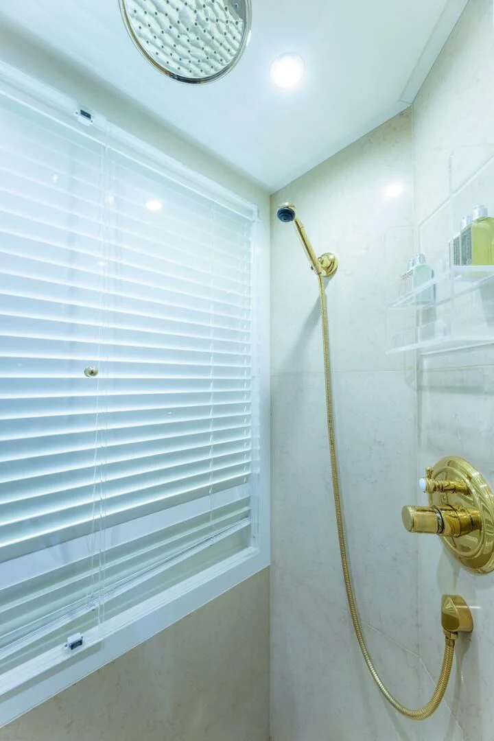 a white wall with a light fixture aboard NAMASTE Yacht for Sale