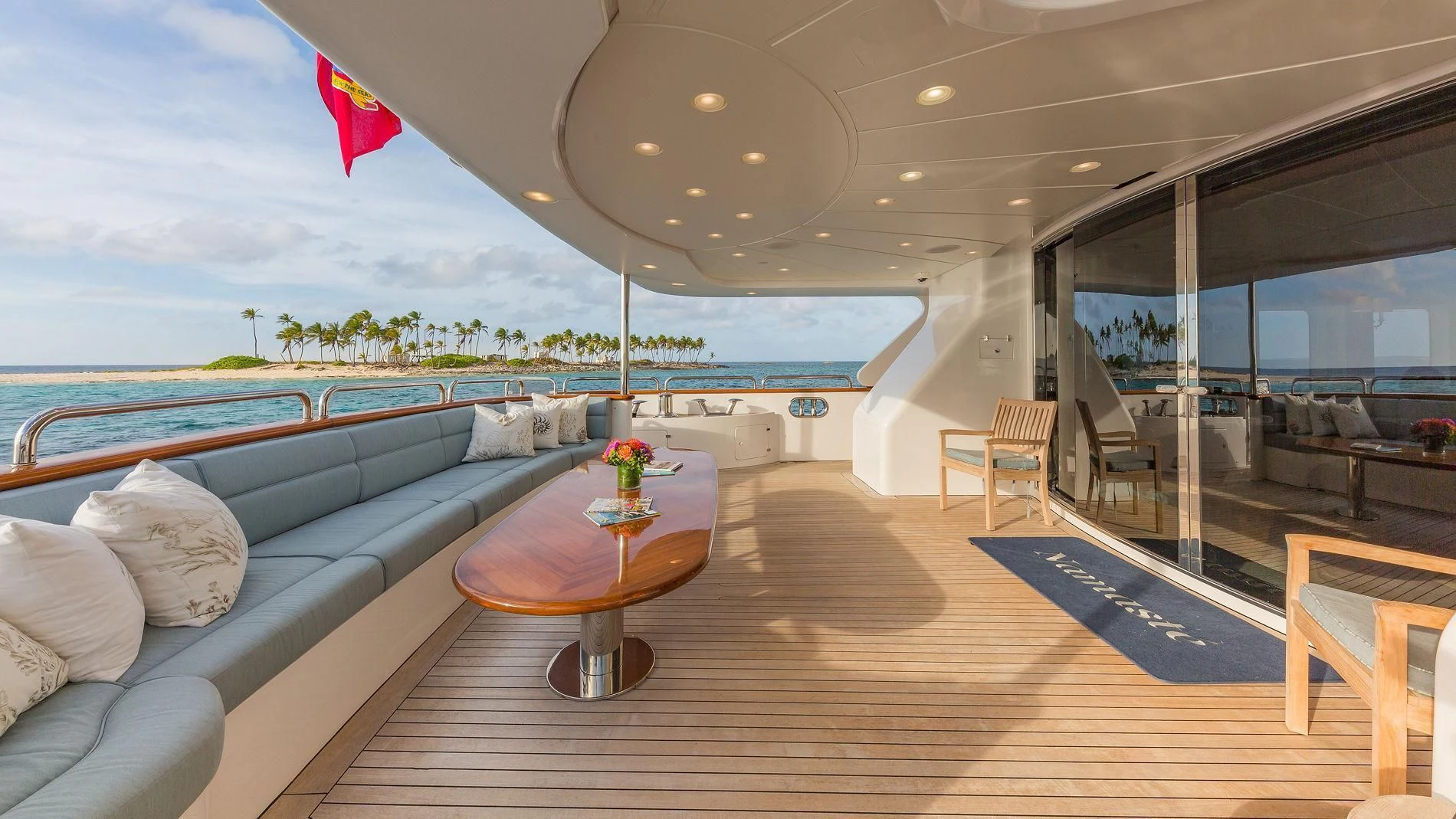 a large living room with a large pool and a deck aboard NAMASTE Yacht for Sale