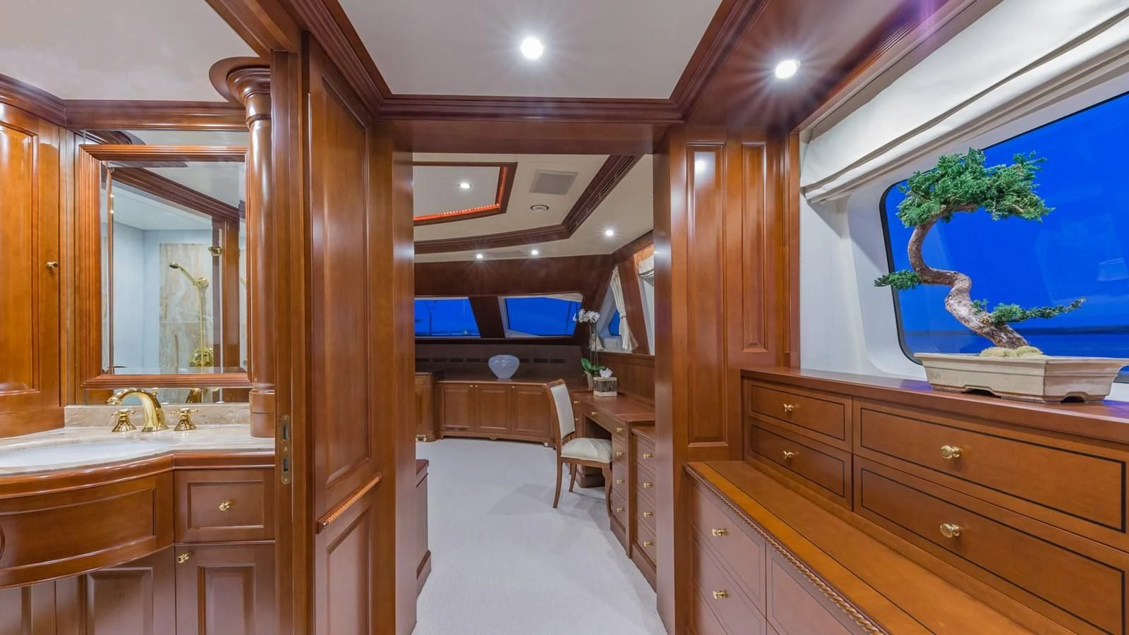 a room with a bed and a desk aboard NAMASTE Yacht for Sale