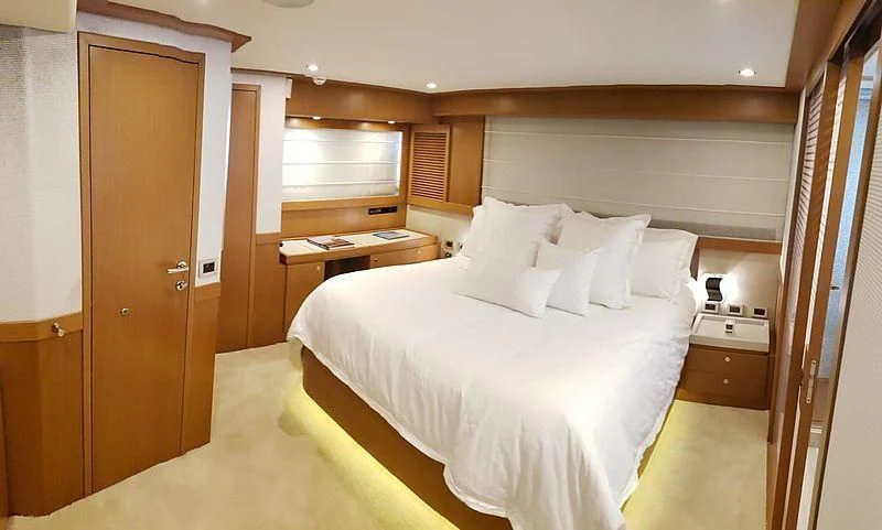 a bed in a room aboard ALL RUMORS Yacht for Sale