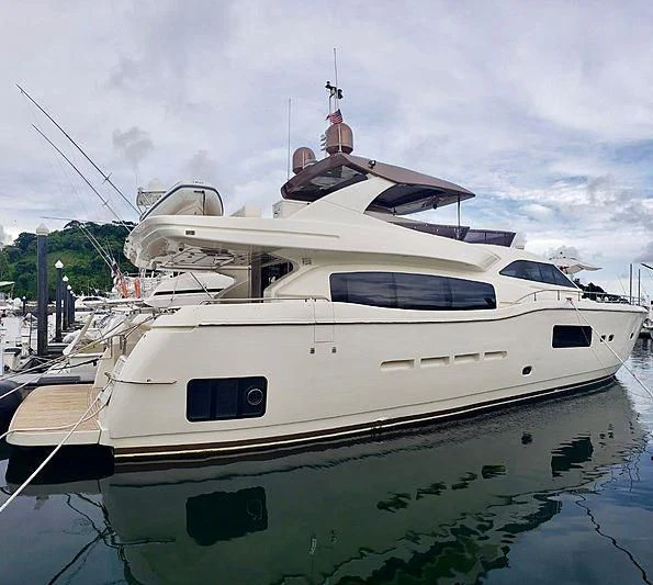a white yacht docked aboard ALL RUMORS Yacht for Sale