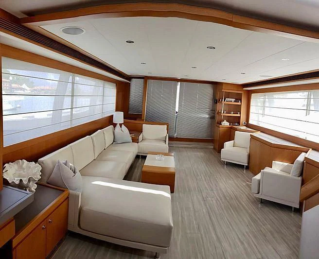 a living room with a large window aboard ALL RUMORS Yacht for Sale