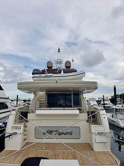 a boat docked at a pier aboard ALL RUMORS Yacht for Sale