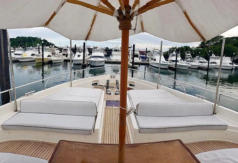 a boat is parked in the water aboard ALL RUMORS Yacht for Sale