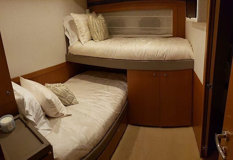 a bed in a room aboard ALL RUMORS Yacht for Sale