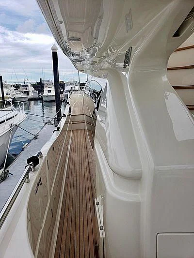 a boat with a wood deck aboard ALL RUMORS Yacht for Sale