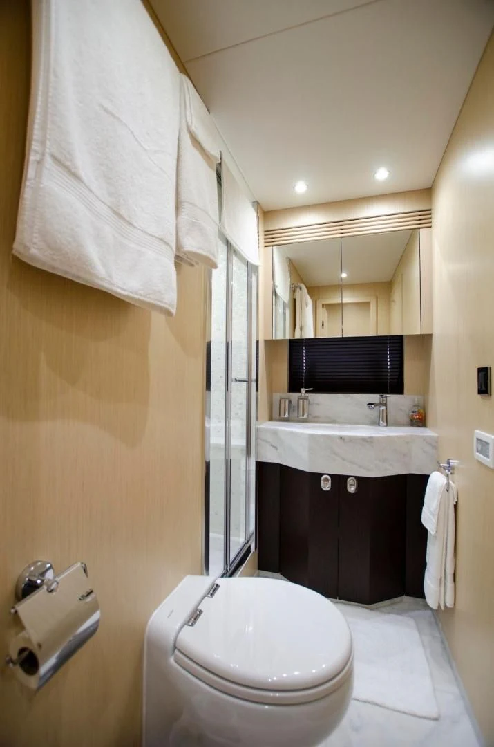 a bathroom with a sink toilet and bathtub aboard SECOND THOUGHTS Yacht for Sale