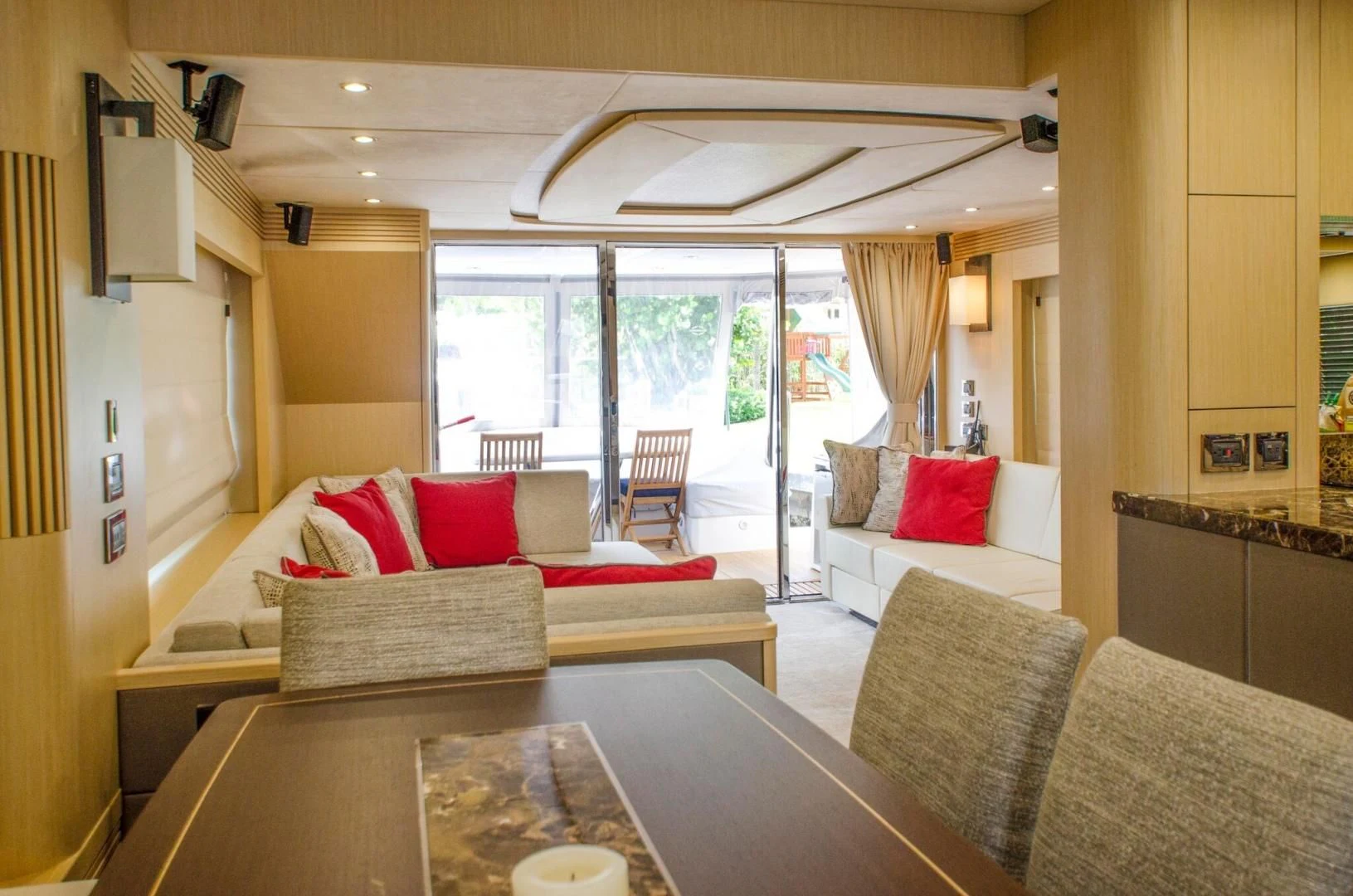 a living room with a table and couches aboard SECOND THOUGHTS Yacht for Sale