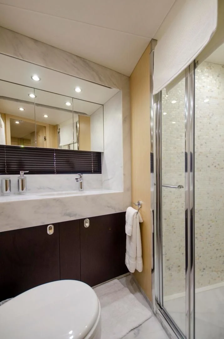 a bathroom with a glass shower aboard SECOND THOUGHTS Yacht for Sale