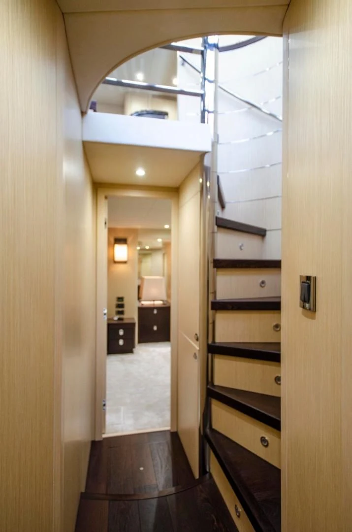 a hallway with a wood floor and a glass door aboard SECOND THOUGHTS Yacht for Sale