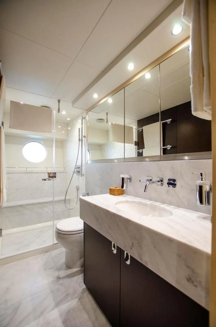 a bathroom with a large mirror aboard SECOND THOUGHTS Yacht for Sale