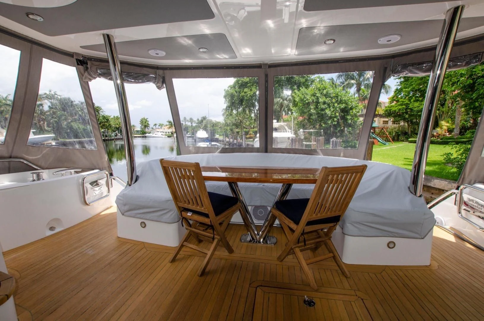 a room with a table and chairs aboard SECOND THOUGHTS Yacht for Sale