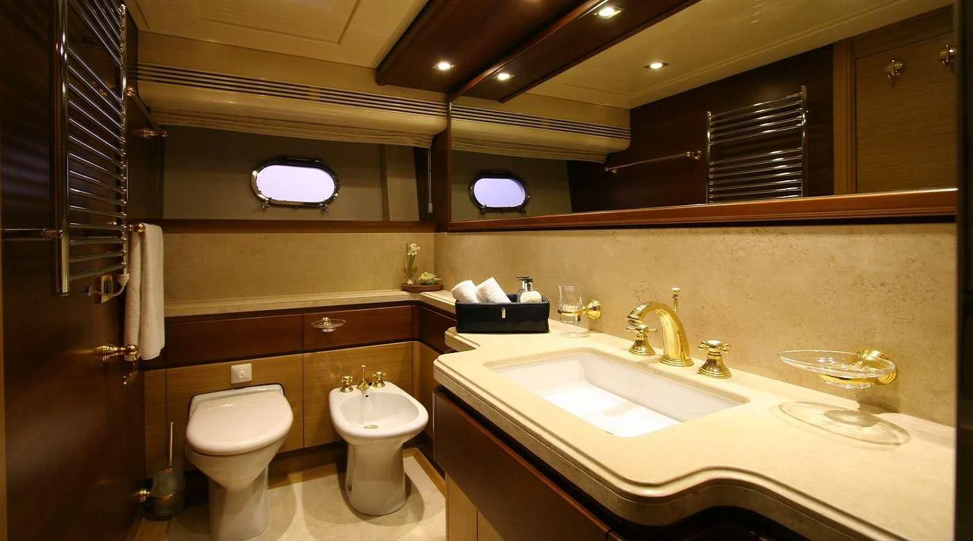 a bathroom with a toilet and sink aboard PAREAKKI Yacht for Sale